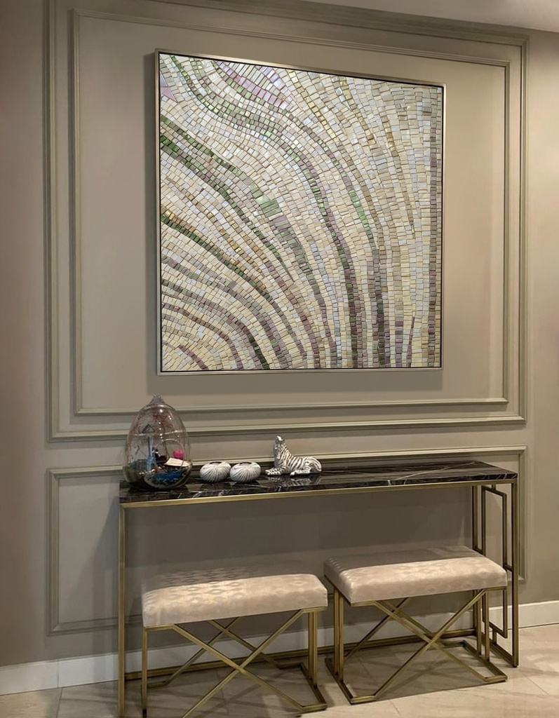 Mosaic wall art with pastel green, lavender, and gold tones forming an abstract plant-like bud on a cream background