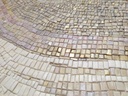 Close up of gold and beige mosaic wall art