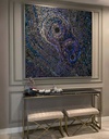 Large mosaic wall art with concentric circles in iridescent indigo, peacock blue, and sapphire shades, creating a dramatic and textured modern design