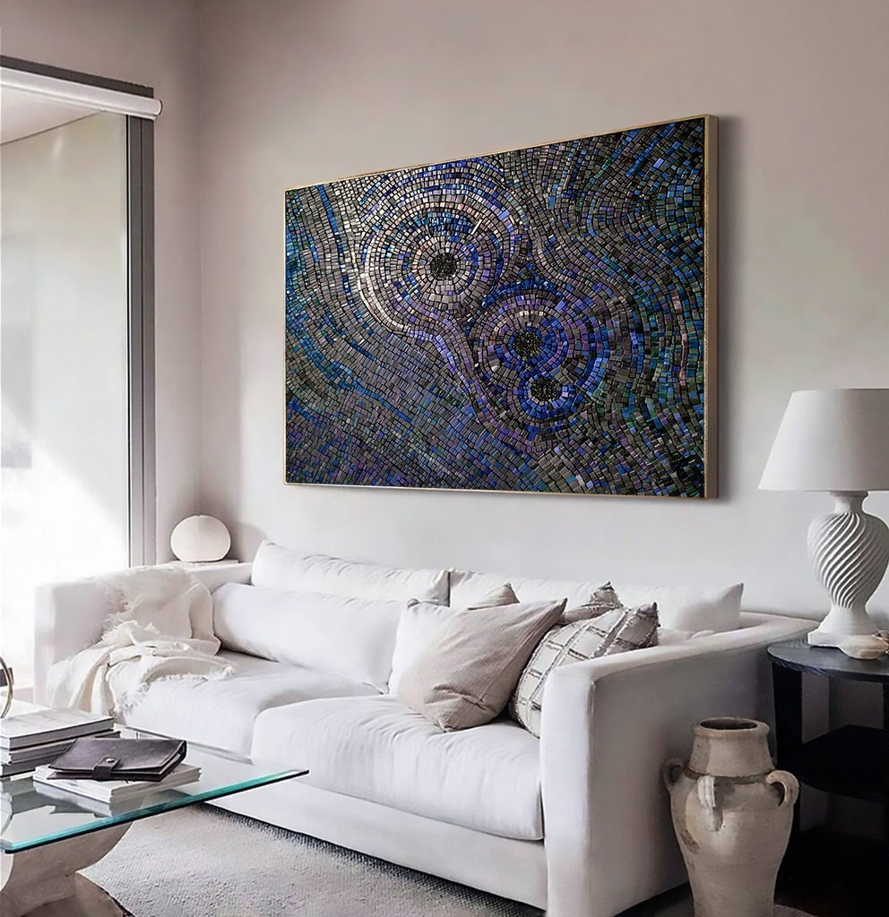 Large mosaic wall art with concentric circles in iridescent indigo, peacock blue, and sapphire shades, creating a dramatic and textured modern design
