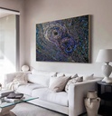 Large mosaic wall art with concentric circles in iridescent indigo, peacock blue, and sapphire shades, creating a dramatic and textured modern design