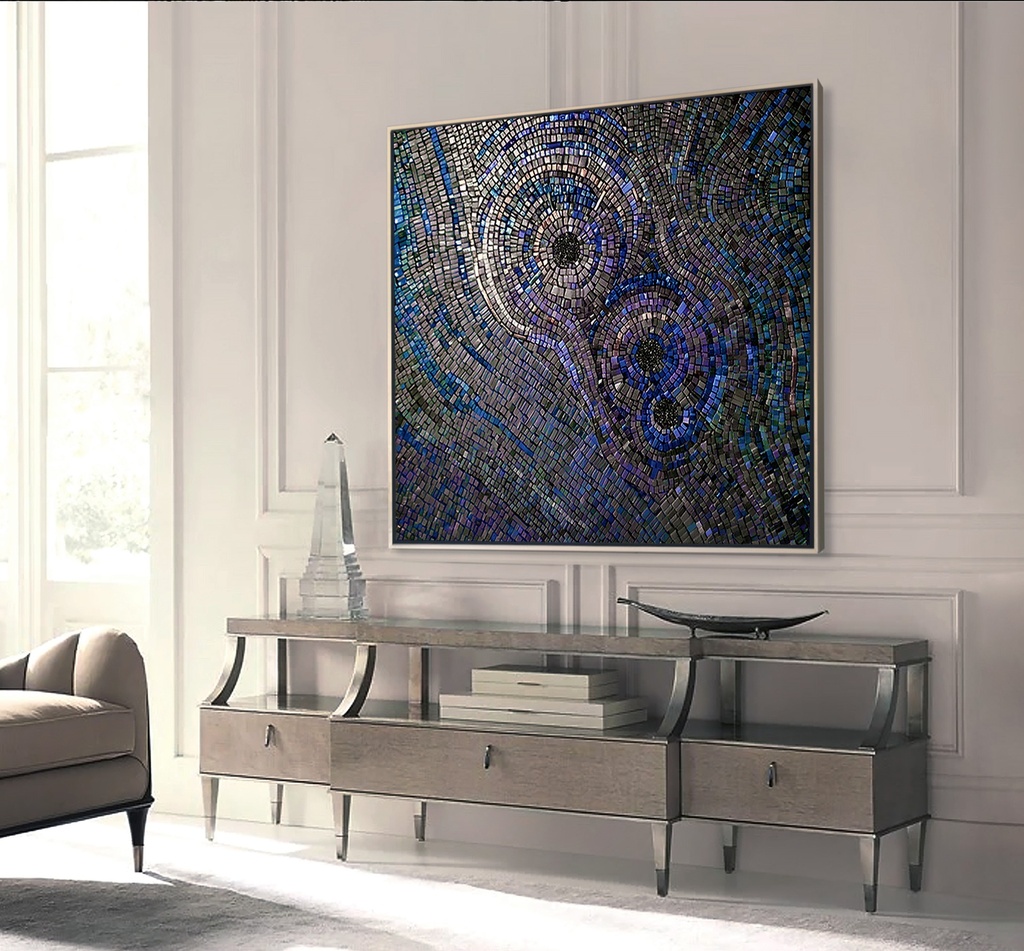 Large mosaic wall art with concentric circles in iridescent indigo, peacock blue, and sapphire shades, creating a dramatic and textured modern design